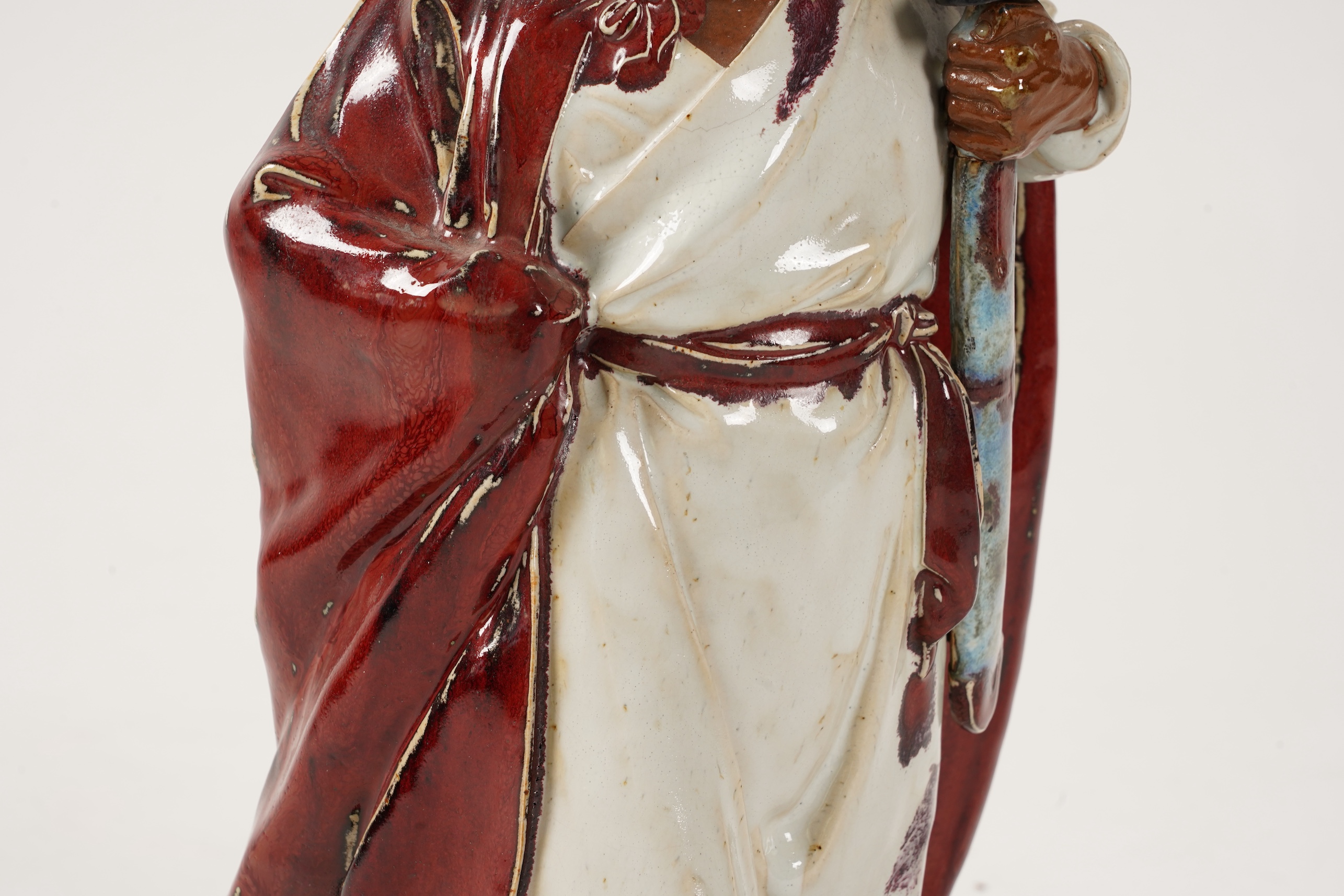 A large Chinese Shiwan stoneware figure of a warrior, 20th century